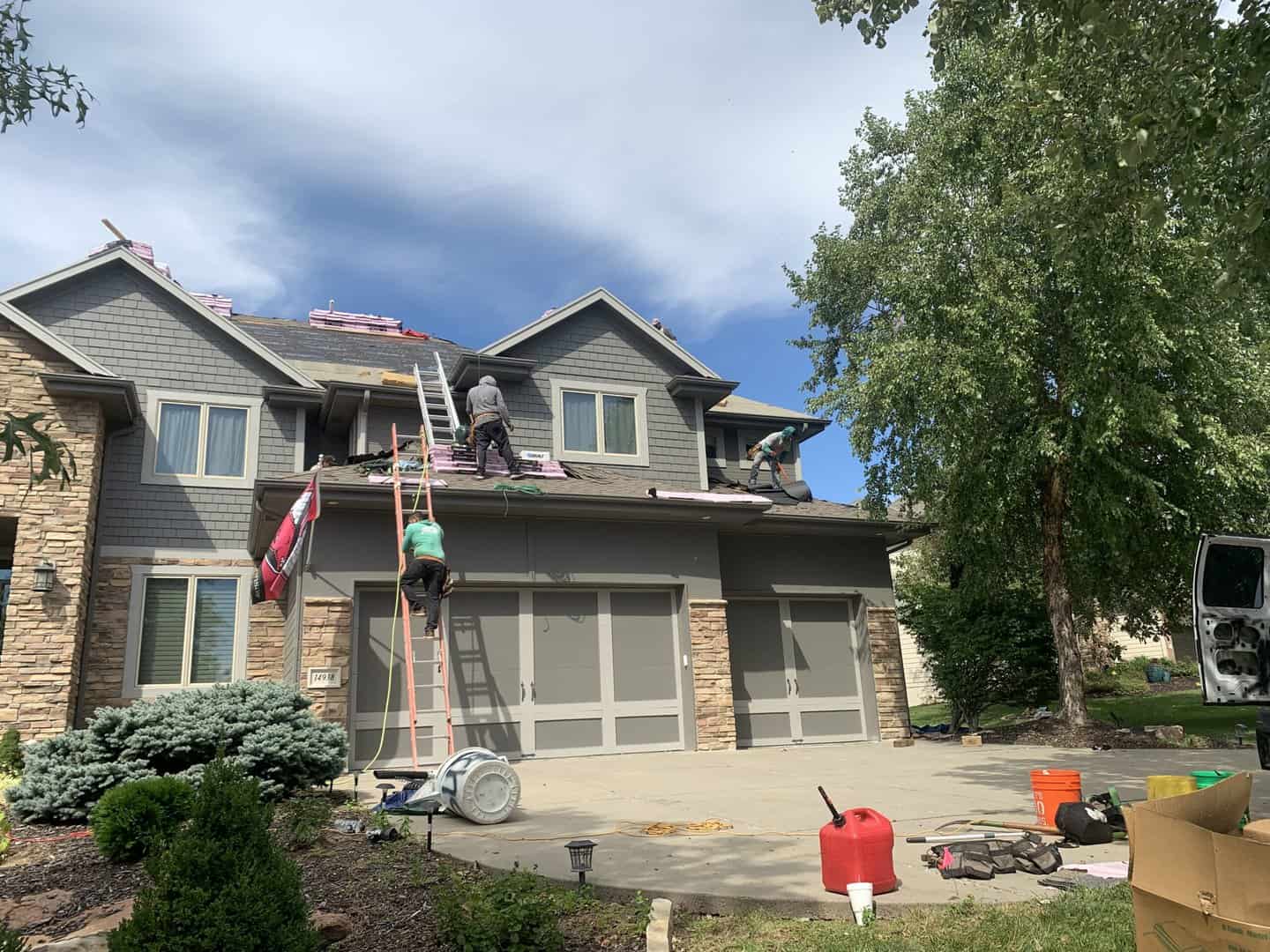 Denver home with asphalt shingle roof installed by denver roofing company